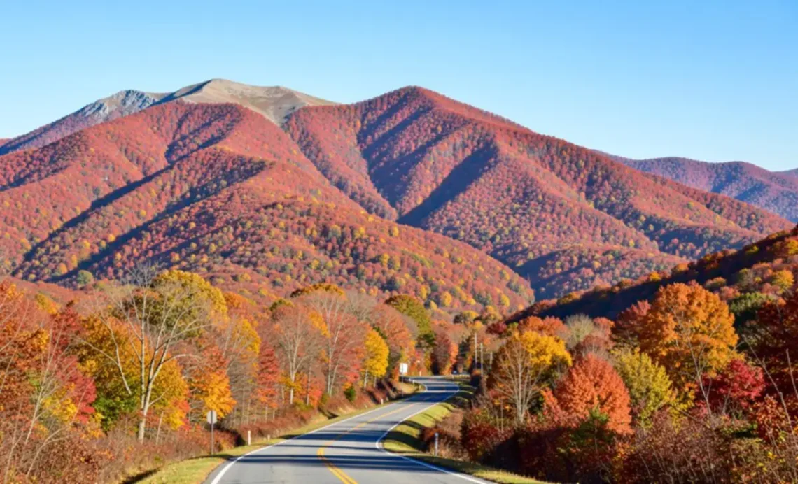 Fall foliage New England mountains with colorful trees along scenic road in autumn