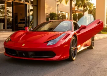 Luxury car rental Ferrari parked at hotel entrance for premium travel experience