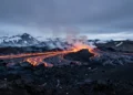 Iceland Volcano with lava flows and steam rising from active crater in volcanic landscape