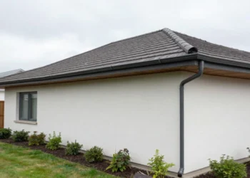 Gutter systems installed on home roof protecting foundation from rainwater damage