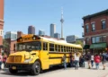 Yellow School Bus Rentals Toronto with group of passengers boarding for organized group travel transportation