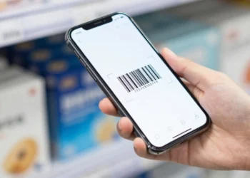 Smartphone camera scanning product barcode with mobile technology showing instant digital information access